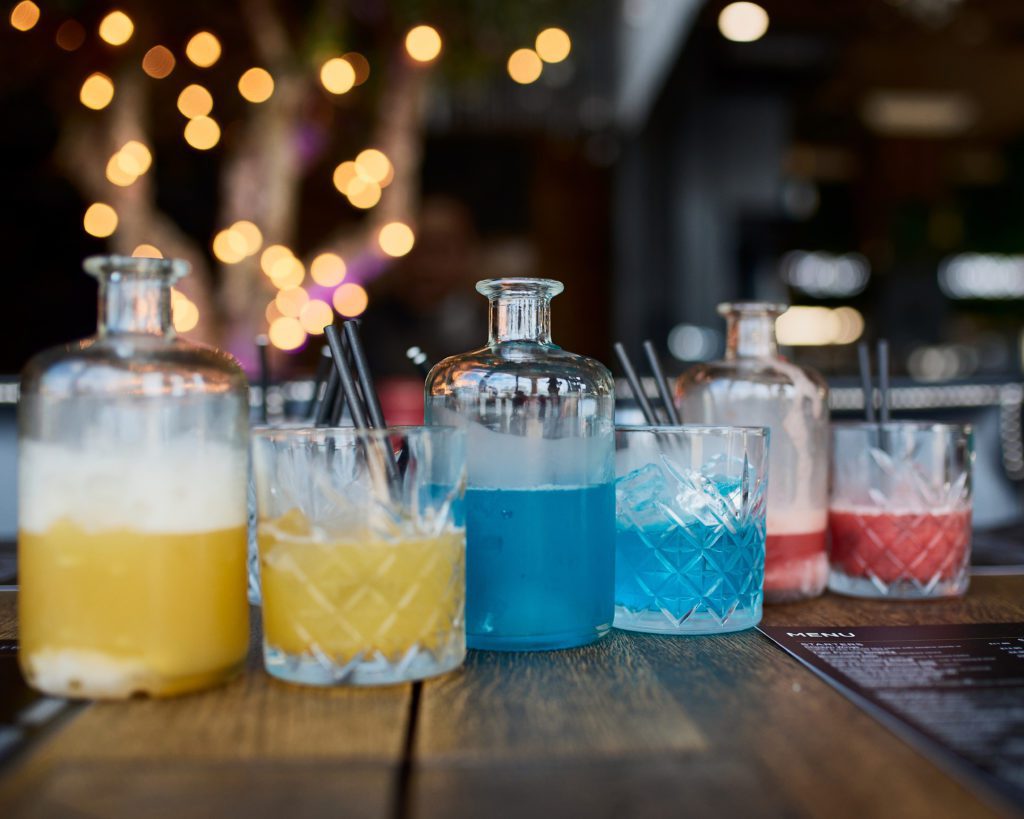 a set of 3 dry ice cocktails sit on a table